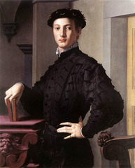 41. Bronzino, Portrait of a Young Man, 1530, CE, Metropolitan Museum of Art, New York, oil on wood. Bronzino's figures usually have the same facial features, both male and female. The artwork is influenced by Pontormo's Guard. The subject is most likely a proud intellectual patrician with his haughty posture, graceful long fingers, book, and severe architecture. The influence of Spanish etiquettes is seen through the man's doublet and cap. Bronzino purposefully sets the color scheme as muted to emphasize the subject's meticulously architecture silhouette. The subject is probably one of Bronzino's literary friends. Bronzino adds a theme of identity through the grotesque heads on the furniture and masklike faces in the folds of his breeches.