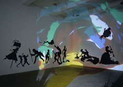 Darkytown Rebellion Kara Walker. 2001 C.E. Cut paper and projection on wall. Black silhouettes against colorful background, sharp lines, distinct and defined shapes. The actual subject of the work is meant to reflect the antebellum South during the time of slavery. Many southern African-American stereotypes are still present today and Walker hoped to make viewers realize how subconsciously they had these premeditated ideas about the figures and the assumptions about race they automatically made because of popular culture.