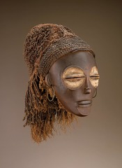 Female (Pwo) mask Chokwe peoples (Democratic Republic of the Congo). Late 19th to early 20th century C.E. Wood, fiber, pigment, and metal Chokwe masks are often performed at the celebrations that mark the completion of initiation into adulthood. That occasion also marks the dissolution of the bonds of intimacy between mothers and their sons. The pride and sorrow that event represents for Chokwe women is alluded to by the tear motif.