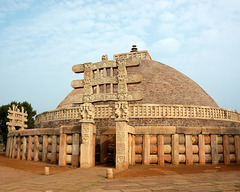Great Stupa at Sanchi Madhya Pradesh, India. Buddhist; Maurya, late Sunga Dynasty. c. 300 B.C.E. - 100 B.C.E. Stone masonry, sandstone on dome It was probably begun by the Mauryan emperor Ashoka in the mid-3rd century bce and later enlarged. Solid throughout, it is enclosed by a massive stone railing pierced by four gateways, which are adorned with elaborate carvings (known as Sanchi sculpture) depicting the life of the Buddha.