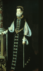 High contrast in black and white with heavy use of trim. hanging sleeves. outer sleeves have brooch. Ruff, pointed waistline and small headdress.