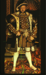 Northern Renaissance. Slashing on the sleeves with attached hanging sleeves. Shirt has a turned-down collar. Codpiece, Netherstocks (lower stockings), Order of the Garter around his leg, Doublet, jerkin, overgown and flat cap. Henry also wears an Order.
