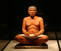 Seated Scribe Saqqara, Egypt. Old Kingdom, Fourth Dynastic. c. 2620-2500 B.C.E. Painted limestone. the sculpture of the seated scribe is one of them most important examples of ancient Egyptian art because it was one of the rare examples of Egyptian naturalism, as most Egyptian art is highly idealized and very rigid.
